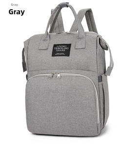 Detail of grey Oxford fabric backpack showing waterproof texture and durable front zipper