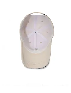 Detail view of the beige baseball cap interior showing the sweatband and stitching