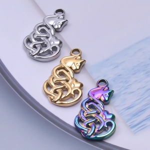 Detailed view of hollow cat pendants with Celtic knots in silver, gold and rainbow finishes