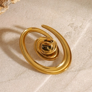 Minimalist spiral golden brooch with a smooth polished finish and butterfly clutch backing