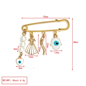 Detailed size chart of a gold evil eye safety pin brooch with decorative charms