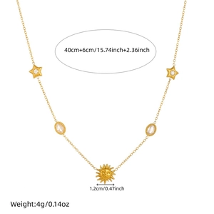 Gold stainless steel oval sun and star necklace with diamond accents on white background