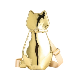 Close-up of golden metallic cat-shaped crossbody bag with adjustable nylon shoulder strap