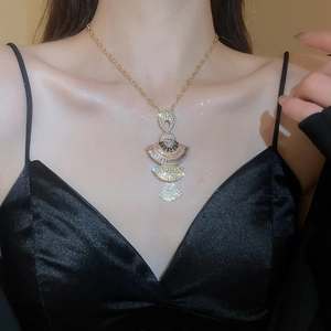 Close-up of fan-shaped necklace set with colorful crystals and rhinestones for women