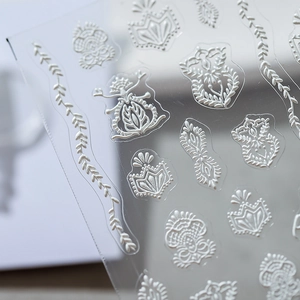 3D white embossed lace nail art stickers with vintage floral patterns on clear film