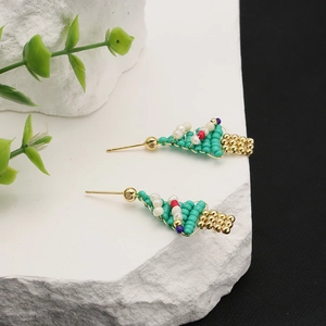Handmade green Christmas tree earrings with natural pearls and golden studs on stone