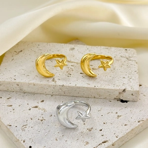 Minimalist moon and stars open rings in gold and silver finish on beige stone
