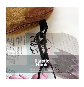 Detail showing the sturdy black plastic hook and soft plush fabric of the Kapybara bag
