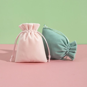 Detailed view of pink and green plush velvet drawstring jewelry gift pouches
