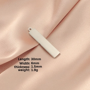 Polished 30x6mm stainless steel rectangular pendant on pink silk with size specs