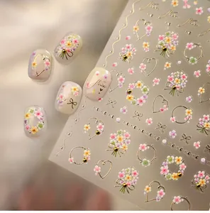 Detailed relief flower nail stickers with gold outlines and pastel floral patterns