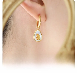 Close-up of elegant avocado-shaped 18k gold plated surgical titanium steel earring