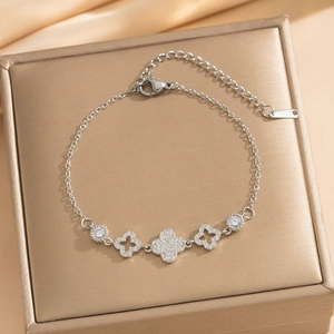 Silver stainless steel clover bracelet with sparkling cubic zirconia and adjustable chain