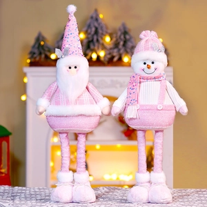 Detail of pink sequin Christmas dolls with retractable legs and plush knit textures