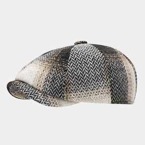 Detail of multi-color herringbone newsboy cap with textured wool blend fabric
