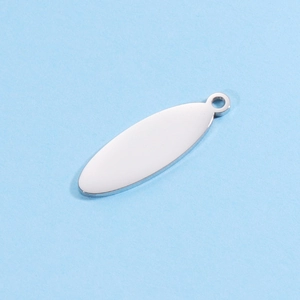 Macro shot of oval stainless steel blank pendant with small loop for DIY jewelry making