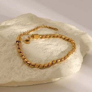 Detail shot of 18K gold plated stainless steel chain bracelet with hallmark on stone