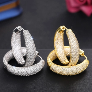 Sparkling pave-set round hoop earrings in silver and gold plating with micro-inlaid zircons