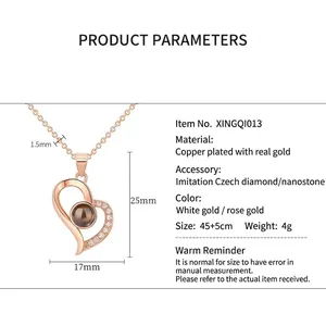 Heart projection necklace in 100 languages with gold plating and cz stones