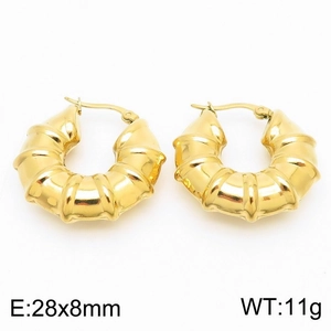 Macro shot of 28x8mm gold U-shaped bamboo earrings in polished 18k stainless steel