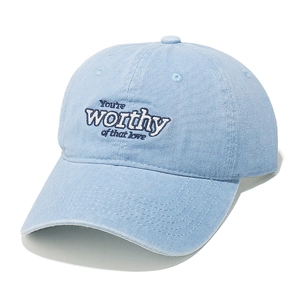 Close-up of You're worthy of that love embroidery on washed light blue denim baseball cap