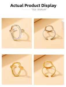 Detail showing adjustable gold and silver hollow oval rings with polished finish