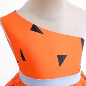 Detail of orange caveman costume for girls featuring black triangle prints and a blue belt
