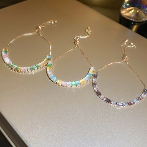 Elegant adjustable gold bracelet with colorful rectangular cubic zirconia in three styles