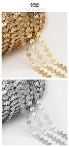 Detail of embossed stainless steel heart chain in gold and silver for DIY jewelry