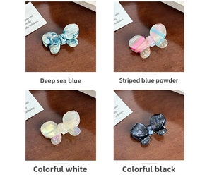 Detailed set of acetate butterfly hair clips with rhinestones in four elegant colors