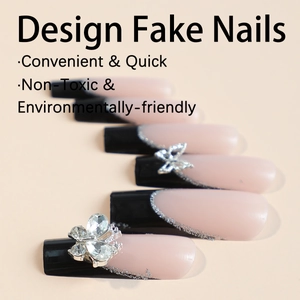 Long French press-on nails with black tips, silver glitter, and a 3D butterfly gem