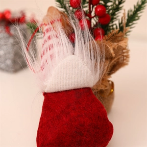 Close-up of knit Christmas gnome ornaments with felt details and hanging loops