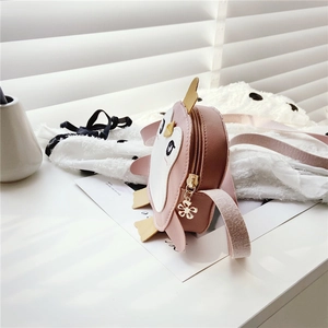 Close-up of pink penguin kids purse with golden flower zipper detail and PU leather