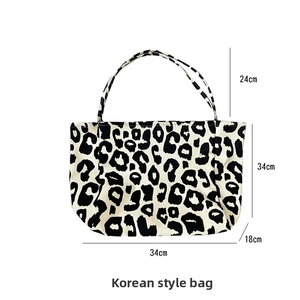 Detailed dimensions of the leopard print canvas tote bag showing height and width markings