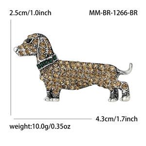 Sparkling rhinestone dachshund puppy brooch with champagne crystals and green collar