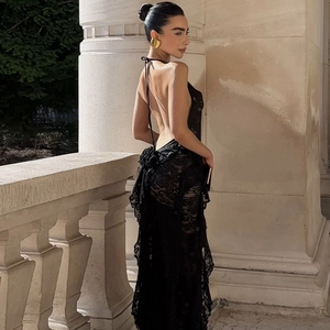Detail of elegant black floral lace fabric with backless halter neck design
