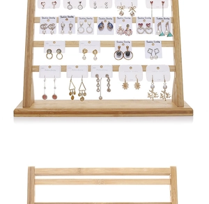 Detail of 4-tier wooden earring display stand showing empty structure and used storage