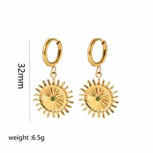 Detail of gold sunburst earrings with green stone inlay, 32mm length and 6.5g weight