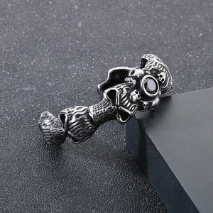 Macro shot of silver gothic skull cuff bracelet with a round black zircon stone inlay