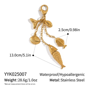 Detailed view of 13cm gold stainless steel fish pendant with technical measurements
