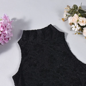 Flat lay of black sleeveless lace bodysuit with high neck and floral patterns