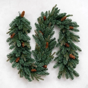Luxury PE mixed Christmas garland with natural pine cones on a grey background