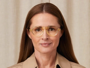 Close-up of stylish round light yellow frames on a model for a trendy fashion look