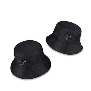 Minimalist black cotton bucket hat with white heart embroidery on clean white background