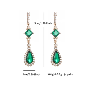 Detailed view of emerald teardrop earrings with dimensions 5cm height and 1cm width