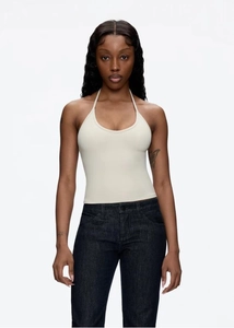 Detail of cream white halter neck top featuring elastic knit fabric and slim fit design
