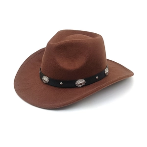 Detail of brown cowboy hat showing black band with vintage silver conchos and studs