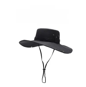 Detailed view of black sun hat with wide brim, adjustable chin strap and side air vents