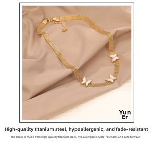 Gold butterfly necklace with mesh chain and white shell inlay pendants detail