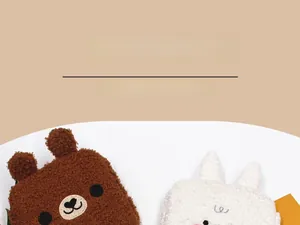Detail of plush teddy fleece storage pouches in cute brown bear and white rabbit shapes